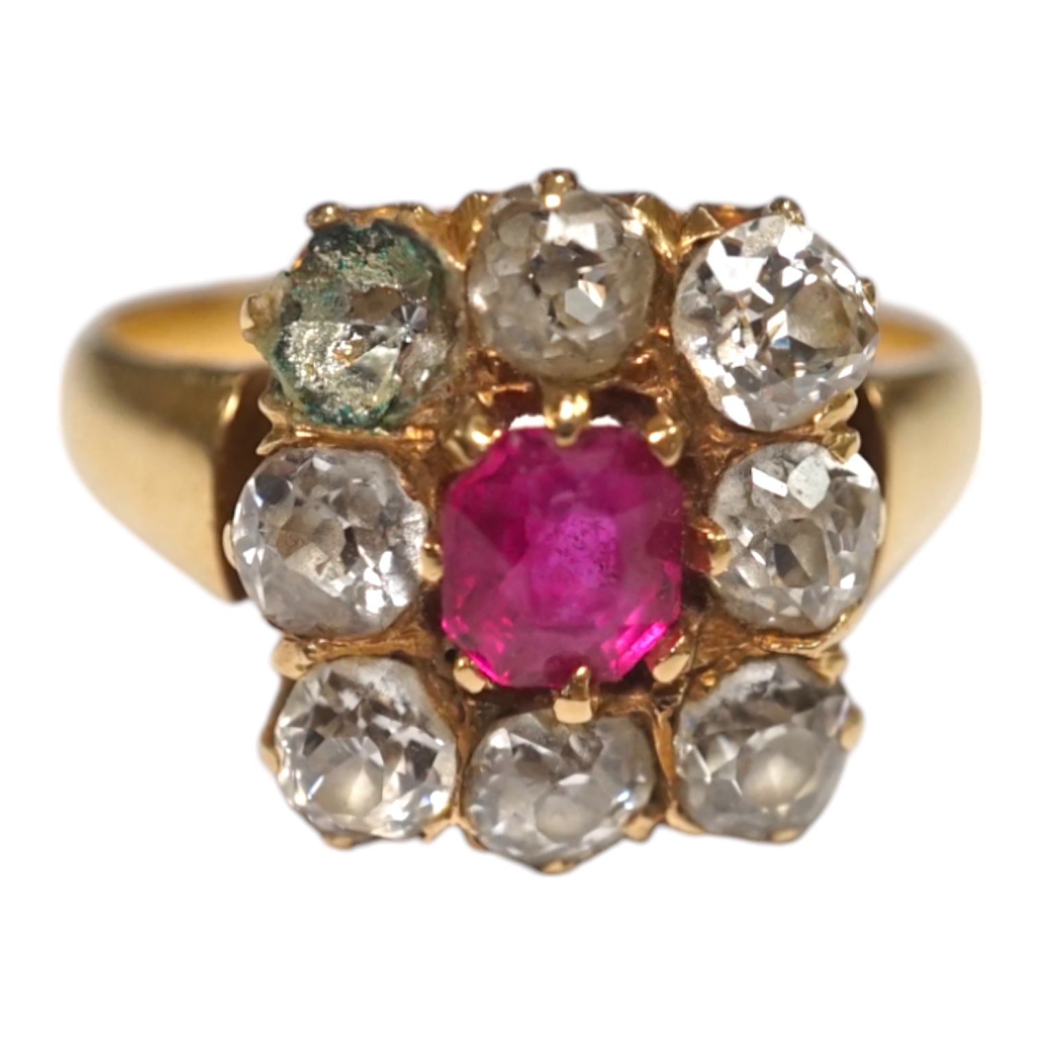 An early 20th century yellow metal, single stone ruby and eight stone diamond set square cluster ring, size O, gross weight 5 grams, one diamond missing. Condition - poor to fair